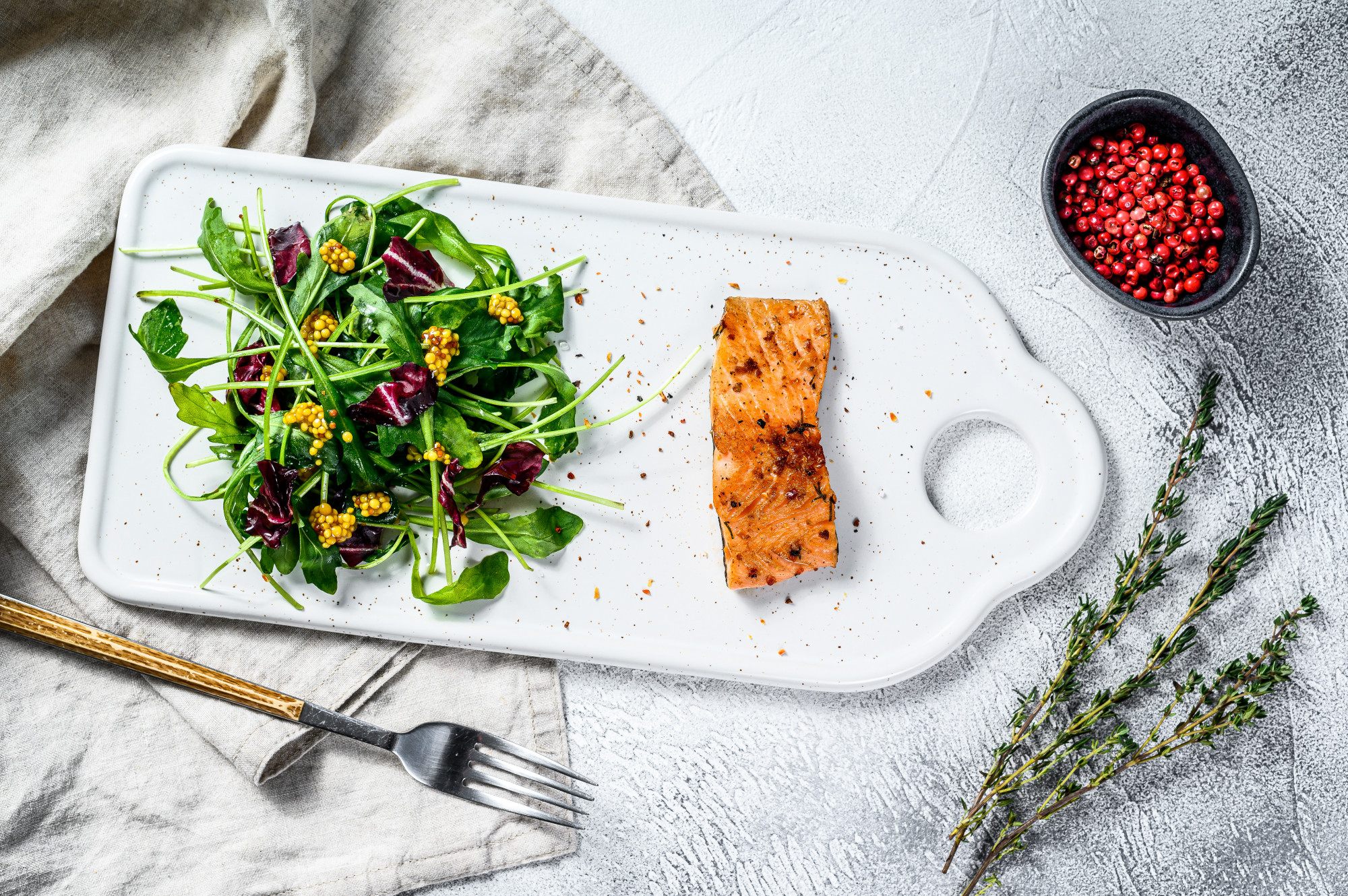 Close-up of roasted salmon with herbs