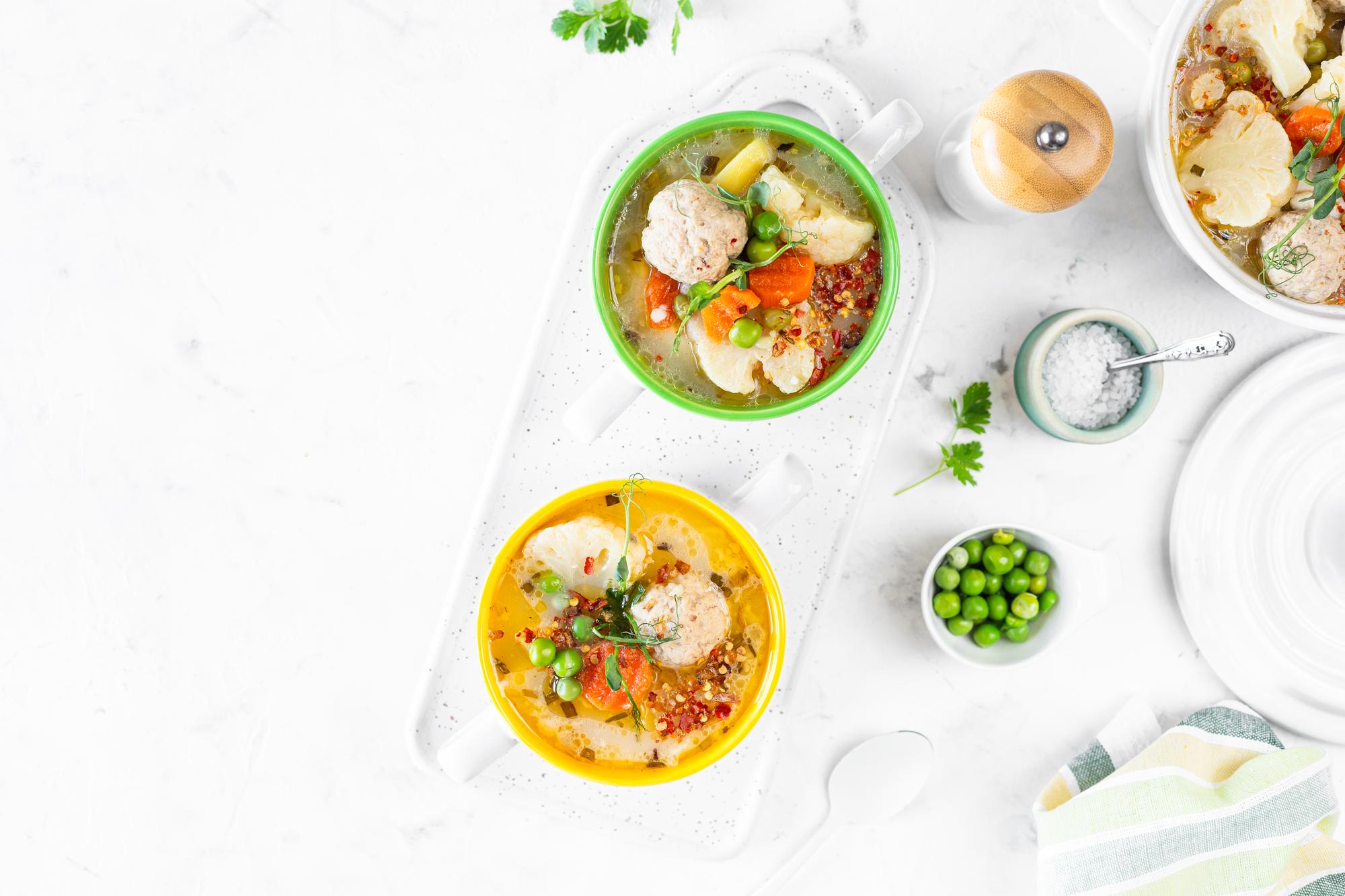 Prepared meal bowls on a light table